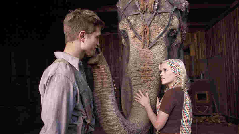 Trainer Wreck: A bereaved circus veterinarian (Robert Pattinson) and a performer (Reese Witherspoon) with an abusive husband are brought closer by their shared affection for an animal colleague in Water for Elephants. Trainer Wreck: A bereaved circus veterinarian (Robert Pattinson) and a performer (Reese Witherspoon) with an abusive husband are brought closer by their shared affection for an animal colleague in Water for Elephants.