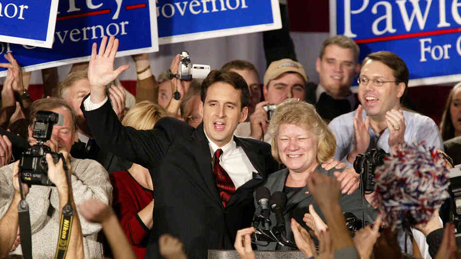 Then-gubernatorial candidate Tim Pawlenty and running mate Carol Molnau celebrate their victory at Republican election headquarters on Nov. 6, 2002, in Bloomington, Minn. The former governor says he was inspired by Ronald Reagan — someone who wasn't considered such a hero 30 years ago in Pawlenty's blue-collar neighborhood. Then-gubernatorial candidate Tim Pawlenty and running mate Carol Molnau celebrate their victory at Republican election headquarters on Nov. 6, 2002, in Bloomington, Minn. The former governor says he was inspired by Ronald Reagan — someone who wasn't considered such a hero 30 years ago in Pawlenty's blue-collar neighborhood.