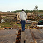 Clifton Perry stands on what's left of this home Monday in Colerain, N.C., where a tornado hit Saturday. Clifton Perry stands on what's left of this home Monday in Colerain, N.C., where a tornado hit Saturday.