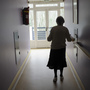 A woman with Alzheimer's disease walks in a corridor at a retirement house in Angervilliers, France, last month. A woman with Alzheimer's disease walks in a corridor at a retirement house in Angervilliers, France, last month.