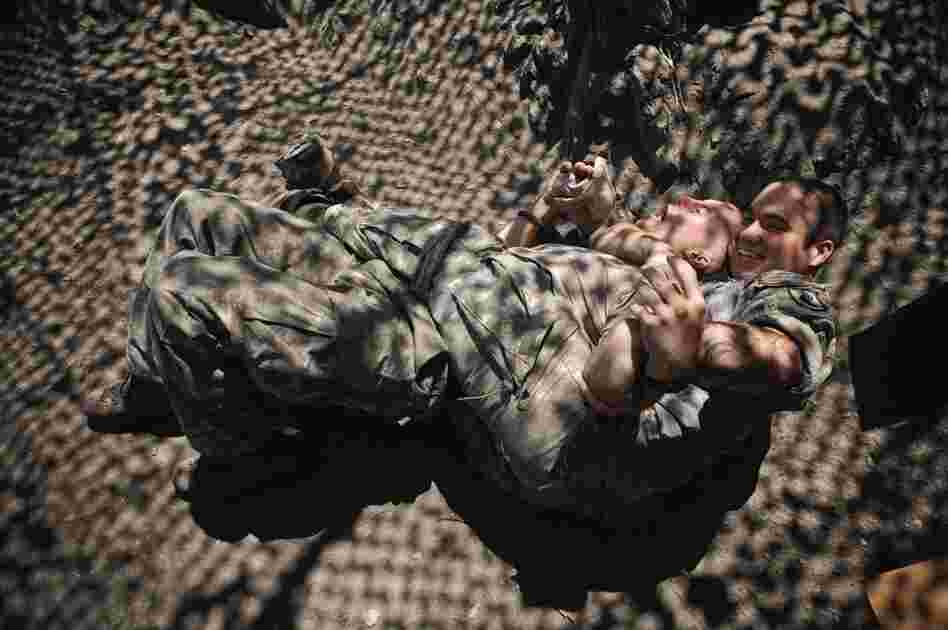 An image from Hetherington's book Infidel which was taken while he was embedded with writer Sebastian Junger in the Korengal Valley of Afghanistan in 2008.