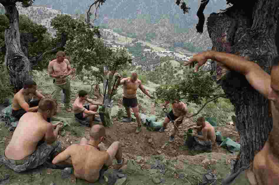 An image from Hetherington's book Infidel which was taken while he was embedded with writer Sebastian Junger in the Korengal Valley of Afghanistan in 2008.