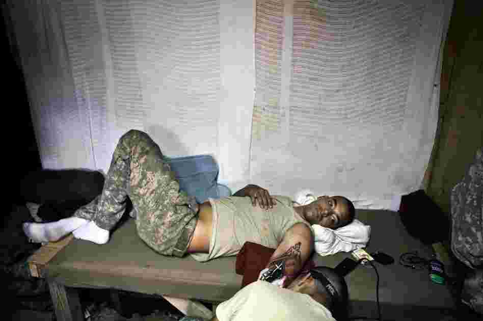 An image from Hetherington's book Infidel which was taken while he was embedded with writer Sebastian Junger in the Korengal Valley of Afghanistan in 2008.