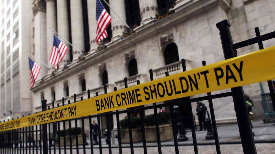 Yellow tape hangs on a fence during a protest outside the New York Stock Exchange last December. Almost three years after the financial crisis, most top Wall Street executives haven't faced any criminal reckoning. Yellow tape hangs on a fence during a protest outside the New York Stock Exchange last December. Almost three years after the financial crisis, most top Wall Street executives haven't faced any criminal reckoning.