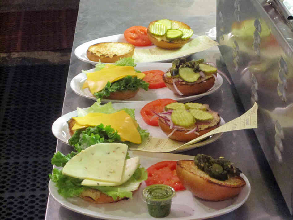 At Ray's Hell Burger in Arlington, Va., burgers are made to order — and can cost up to $18 each. Owner Michael Landrum says he thinks of them not as expensive burgers, but as inexpensive steaks. At Ray's Hell Burger in Arlington, Va., burgers are made to order — and can cost up to $18 each. Owner Michael Landrum says he thinks of them not as expensive burgers, but as inexpensive steaks.