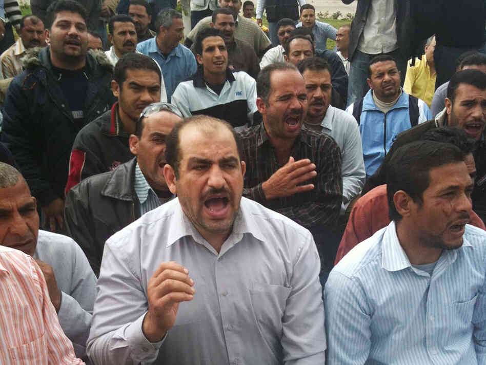 Textile workers at Shebin El-Kom protest on the grounds of the factory in Menoufia, about 90 miles from Cairo in the Nile Delta. Textile workers at Shebin El-Kom protest on the grounds of the factory in Menoufia, about 90 miles from Cairo in the Nile Delta.