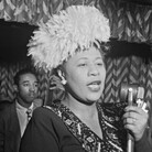 Ella Fitzgerald performs with the Dizzy Gillespie Big Band in 1947. That's Gillespie to her right, in complete awe. Ella Fitzgerald performs with the Dizzy Gillespie Big Band in 1947. That's Gillespie to her right, in complete awe.