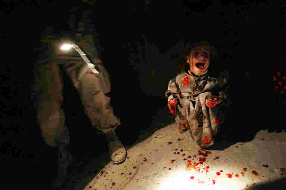 Samar Hassan, 5, screams after her parents were killed by U.S. soldiers with the 25th Infantry Division in a shooting in Tal Afar, Iraq, on Jan. 18, 2005. The troops fired on the Hassan family car when it unwittingly approached them during a patrol in the tense northern Iraqi town. Parents Hussein and Camila Hassan were killed instantly, and a son Racan, 11, was seriously wounded in the abdomen...