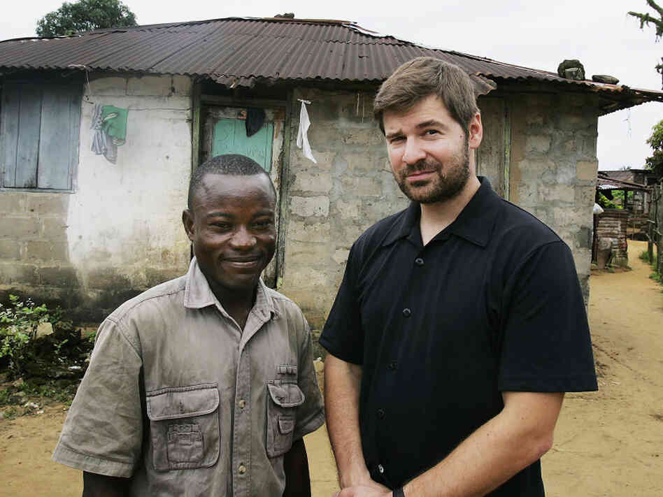 Photojournalist Chris Hondros poses with a a former Liberian government soldier, at his home in Monrovia, Liberia, in 2005. Hondros' picture of Duo jumping into the air in exultation during a battle with rebel forces in 2003 was distributed around the world. Hondros was killed April 20 in Misrata, Libya. Photojournalist Chris Hondros poses with a a former Liberian government soldier, at his home in Monrovia, Liberia, in 2005. Hondros' picture of Duo jumping into the air in exultation during a battle with rebel forces in 2003 was distributed around the world. Hondros was killed April 20 in Misrata, Libya.