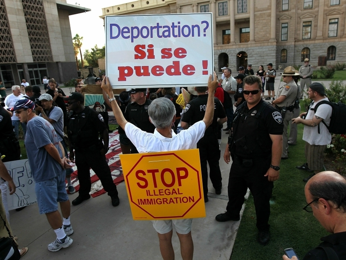A demonstration against illegal immigration last July in Phoenix brought out hundreds of supporters of SB 1070.