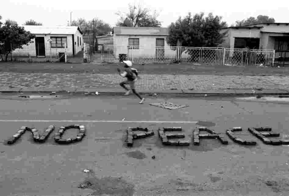 Greg Marinovich and Joao Silva are members of "The Bang-Bang Club," a group of photographers who covered the civil war in South Africa and the waning days of apartheid. Silva snapped this photo shortly before South Africa's first nonsegregated election in April 1994. 
