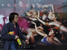 In Hong Kong earlier today, a man walked past a poster for 3D Sex and Zen: Extreme Ecstasy. In Hong Kong earlier today, a man walked past a poster for 3D Sex and Zen: Extreme Ecstasy.