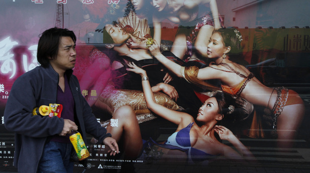 In Hong Kong earlier today, a man walked past a poster for 3D Sex and Zen: Extreme Ecstasy.