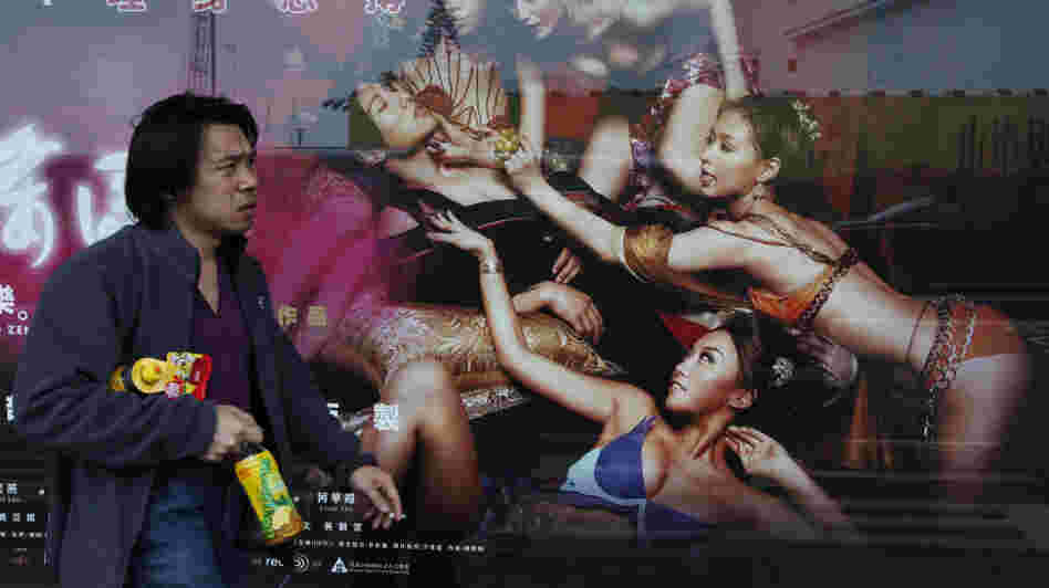 In Hong Kong earlier today, a man walked past a poster for 3D Sex and Zen: Extreme Ecstasy.