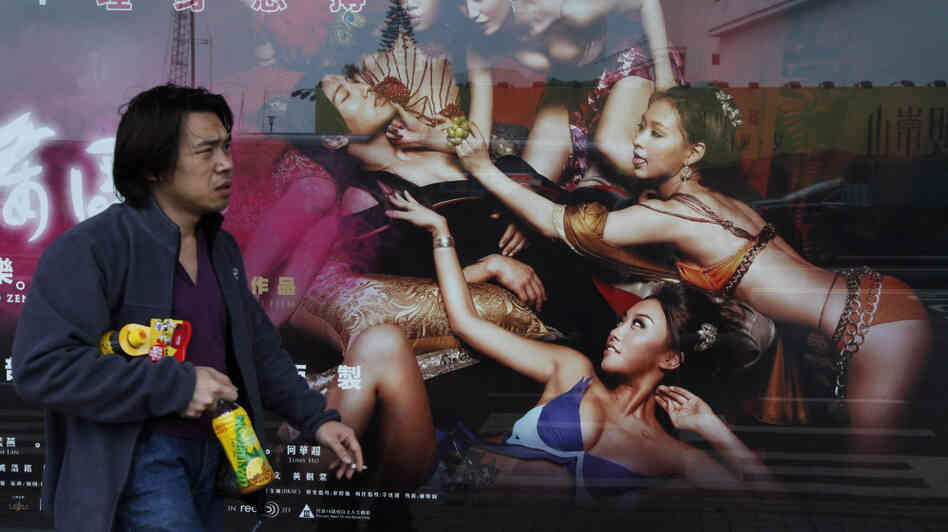 In Hong Kong earlier today, a man walked past a poster for 3D Sex and Zen: Extreme Ecstasy.