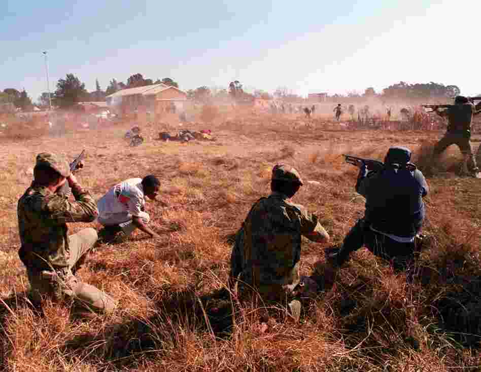 Marinovich was shot three times while covering battles in South Africa. Here, he documented policemen who opened fire on an unarmed crowd of Boipatong residents days after a massacre in 1992. 