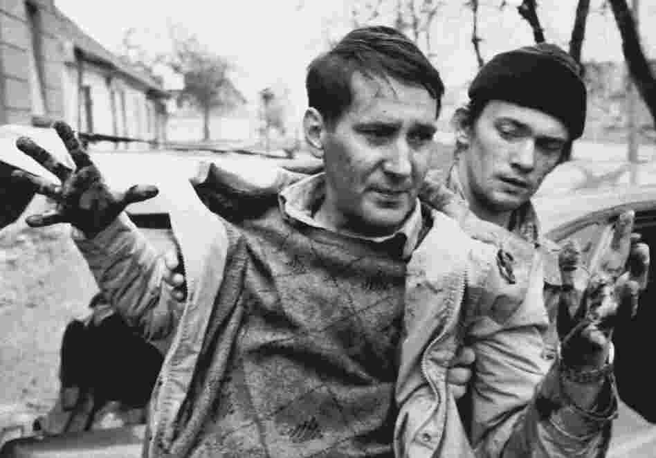 Marinovich traveled to the Balkans in 1991 to document the Yugoslavian conflict. Here, he captured a wounded civilian who was helped to a car by a passerby during an artillery attack in Croatia on Nov. 30, 1991. 