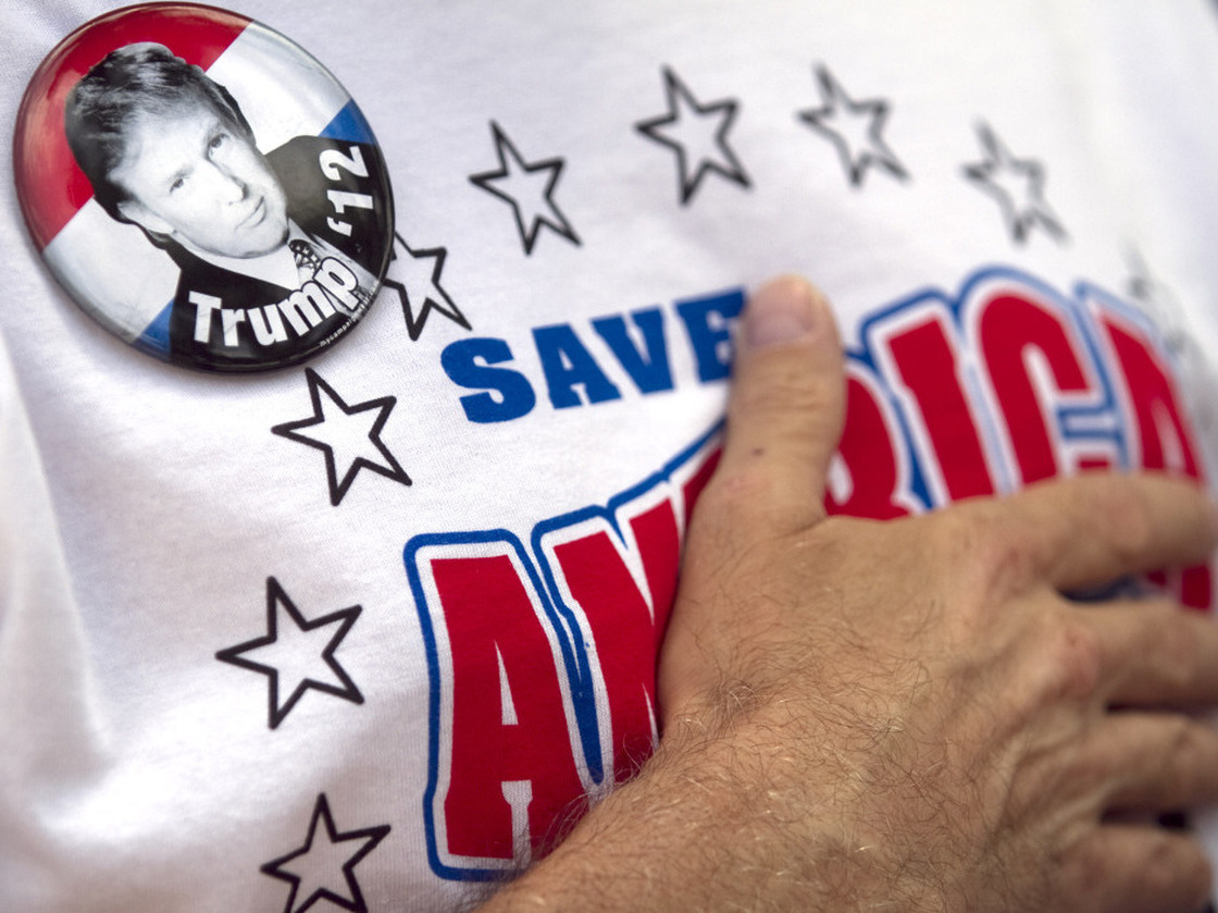 A supporter of Donald Trump holds his hand on his chest while singing the national anthem at the 2011 Palm Beach County Tax Day Tea Party on April 16, 2011 in Boca Raton,  Florida.