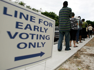 People wait in line at the Boynton Beach Civic Center in Palm Beach County, Fla., for early voting, on Oct. 22, 2008. That year, early voting helped Barack Obama carry the state. Now, Republicans want to shorten the number of days Floridians can vote early.