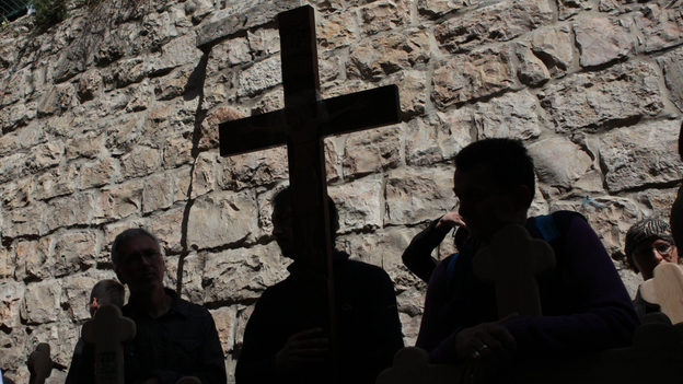 Christian pilgrims carried wooden crosses along the Via Dolorosa during the Good Friday procession in Jerusalem's old city today (April 22, 2011).