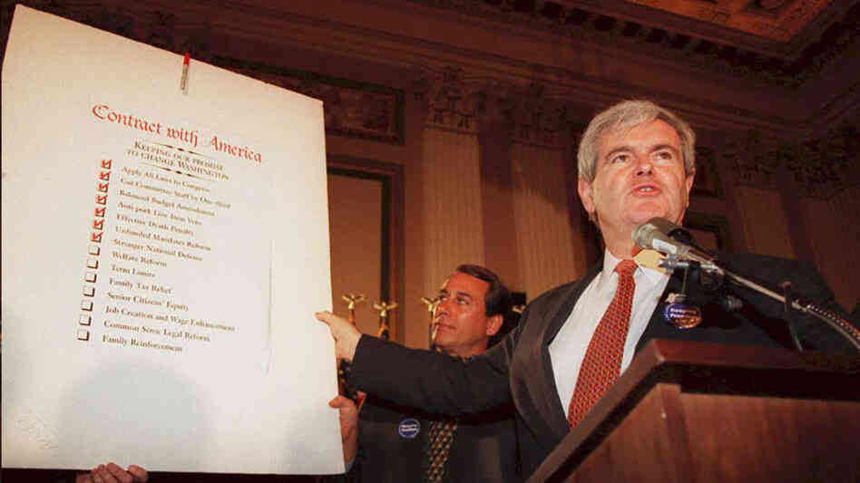Then-House Speaker Newt Gingrich holds up a copy of the Republican Party's "Contract with America" during a rally to celebrate the first 50 days of the Republican majority in Congress in 1995. Then-House Speaker Newt Gingrich holds up a copy of the Republican Party's "Contract with America" during a rally to celebrate the first 50 days of the Republican majority in Congress in 1995.