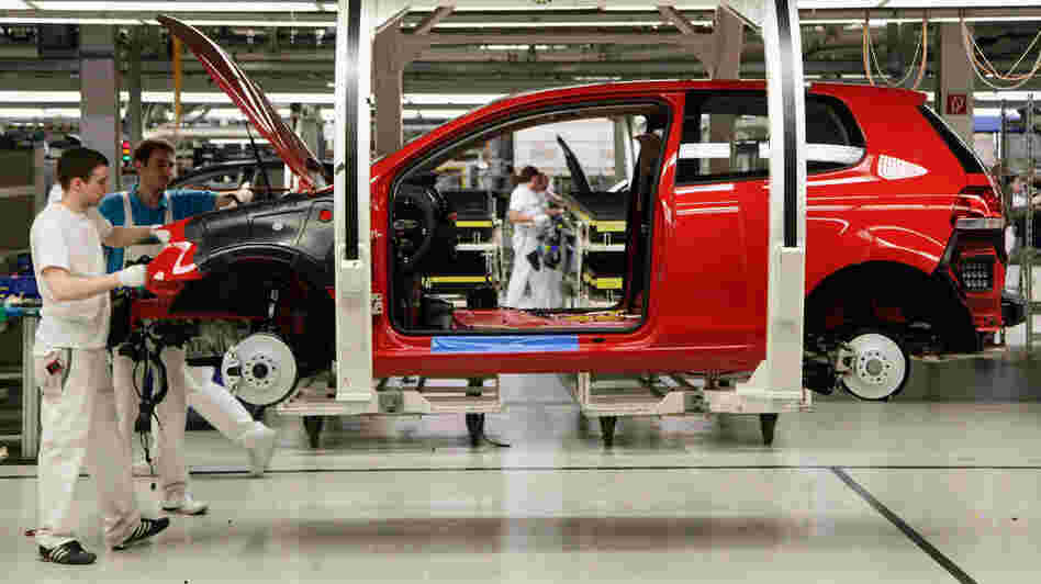 Workers assemble Volkswagen Golf 6 cars at the Volkswagen factory in Wolfsburg, Germany. Volkswagen and other German automakers are among those driving Germany's economic boom.