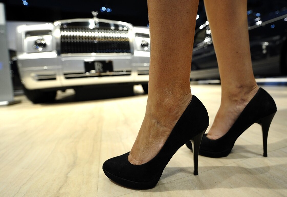 A model stands with the Rolls-Royce Phantom Drophead Coupe at the New York International Auto Show.