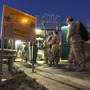 U.S. military guards arrive for their sunrise shift at Camp Delta at the U.S. detention center in Guantanamo Bay, Cuba. U.S. military guards arrive for their sunrise shift at Camp Delta at the U.S. detention center in Guantanamo Bay, Cuba.