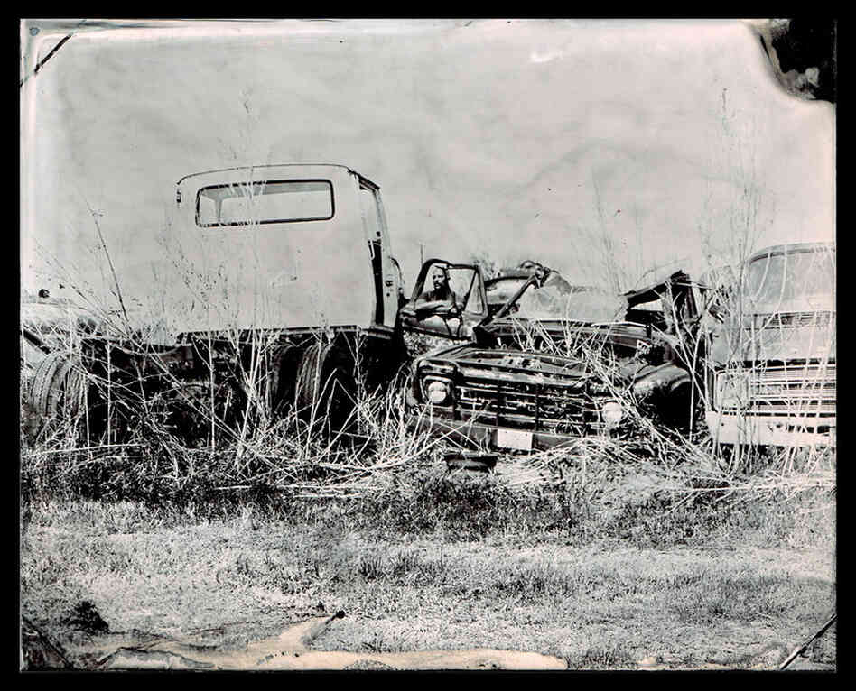 Photographer Tod Seelie in a scrapyard in La Grange, Texas
