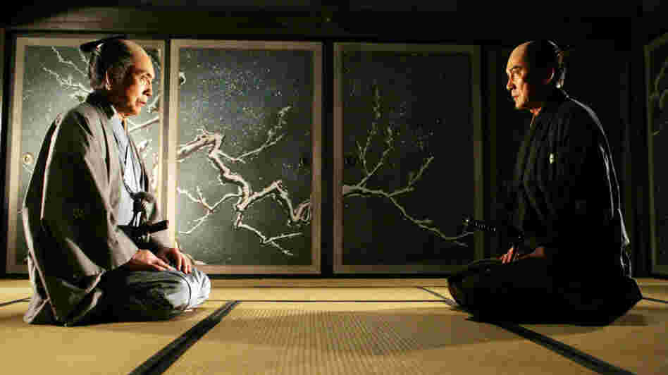 The veteran samurai Shinzaemon (Koji Yakusho, right, with Mikijiro Hira) is recruited out of semi-retirement to plan — and execute — the villain's demise.