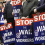 Public employees hold protest signs at an April 4 union rally in Cleveland. Public employees hold protest signs at an April 4 union rally in Cleveland.