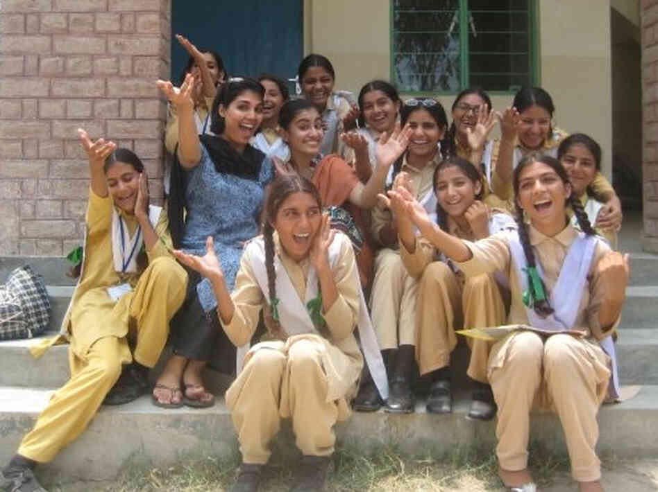 Nadia Naviwala and her students sing on the steps of an NGO-built school in Minhala, Pakistan. Nadia Naviwala and her students sing on the steps of an NGO-built school in Minhala, Pakistan.