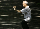 A man performs tai chi for his morning exercise in Beijing, China. A man performs tai chi for his morning exercise in Beijing, China.