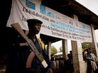 A Congolese soldier stands guard at a trial for 11 people charged with mass rape. A Congolese soldier stands guard at a trial for 11 people charged with mass rape.