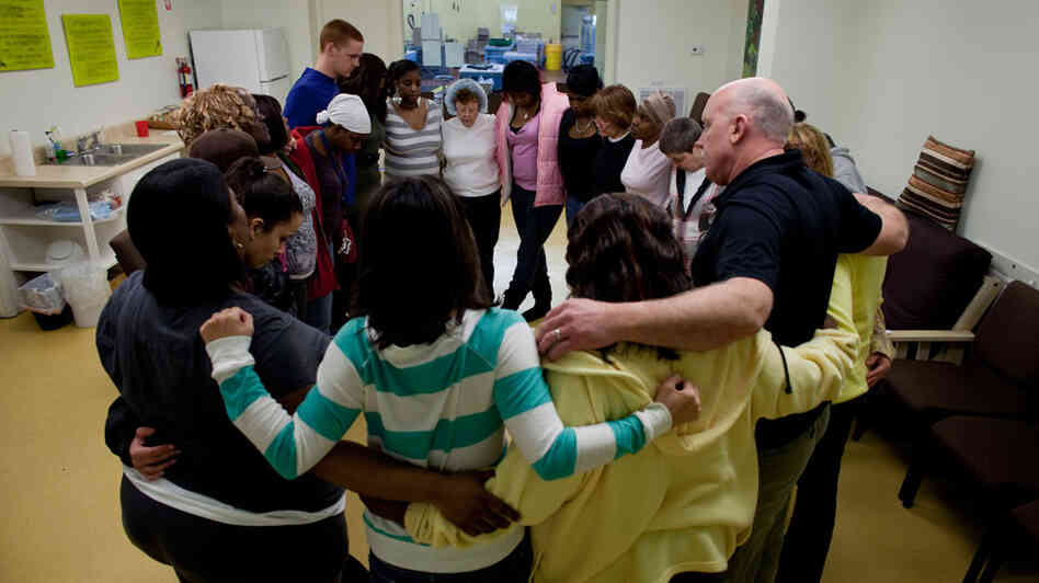 People gather in a support circle at Thistle Farms.