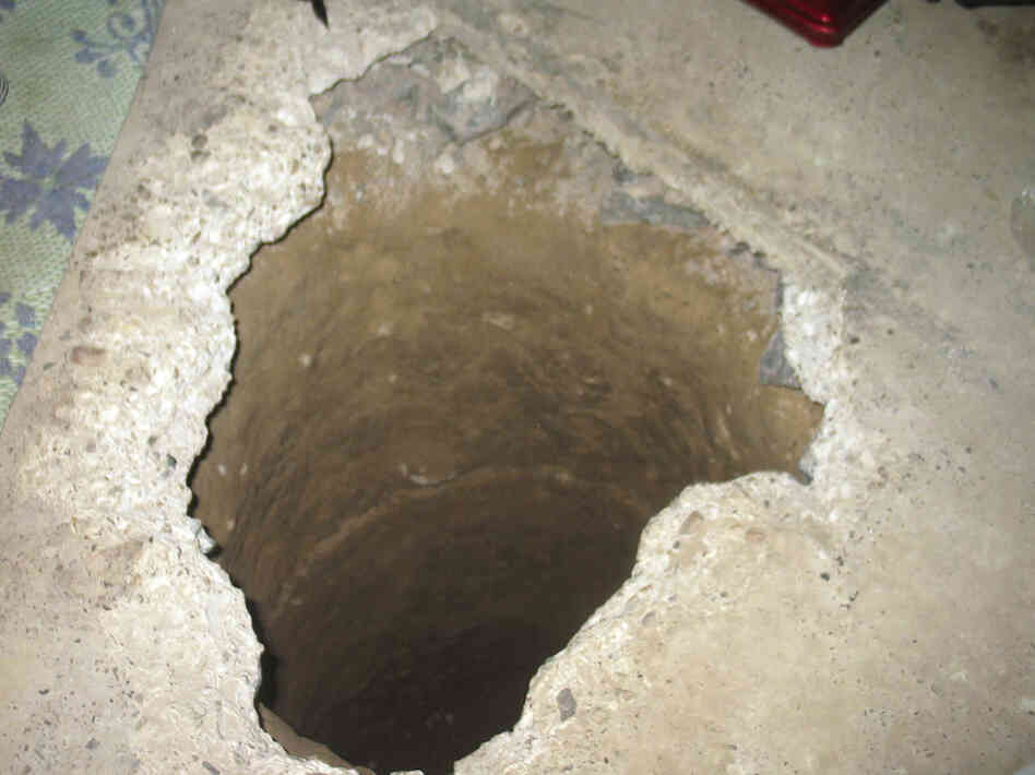 The way out: Taliban fighters escaped from the prison through this hole, and the 1,000-foot tunnel beyond.