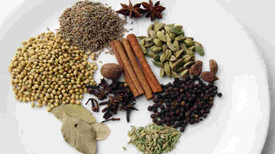 The spices of garam masala can include (clockwise from top left): cumin, star anise, cardamom seeds, black cardamom, black peppercorns, fennel seeds, bay leaf, coriander seeds, cinnamon stick, cloves and nutmeg.
