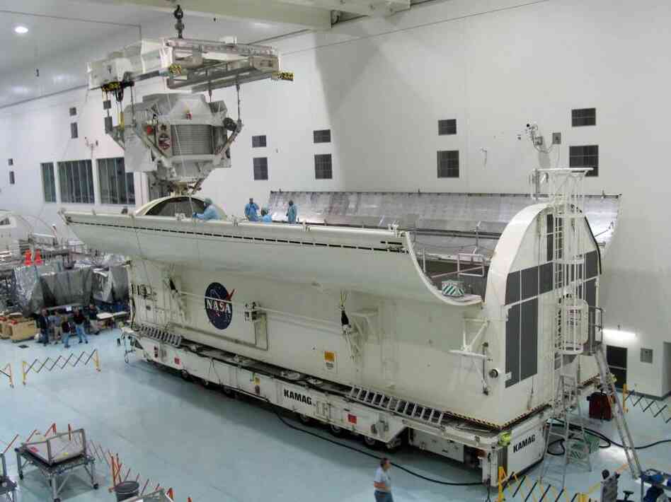 The Alpha Magnetic Spectrometer is loaded into the vehicle that would take it to the space shuttle launchpad on March 15. The $2 billion cosmic ray detector will be carried to the International Space Station on Endeavour's final flight.