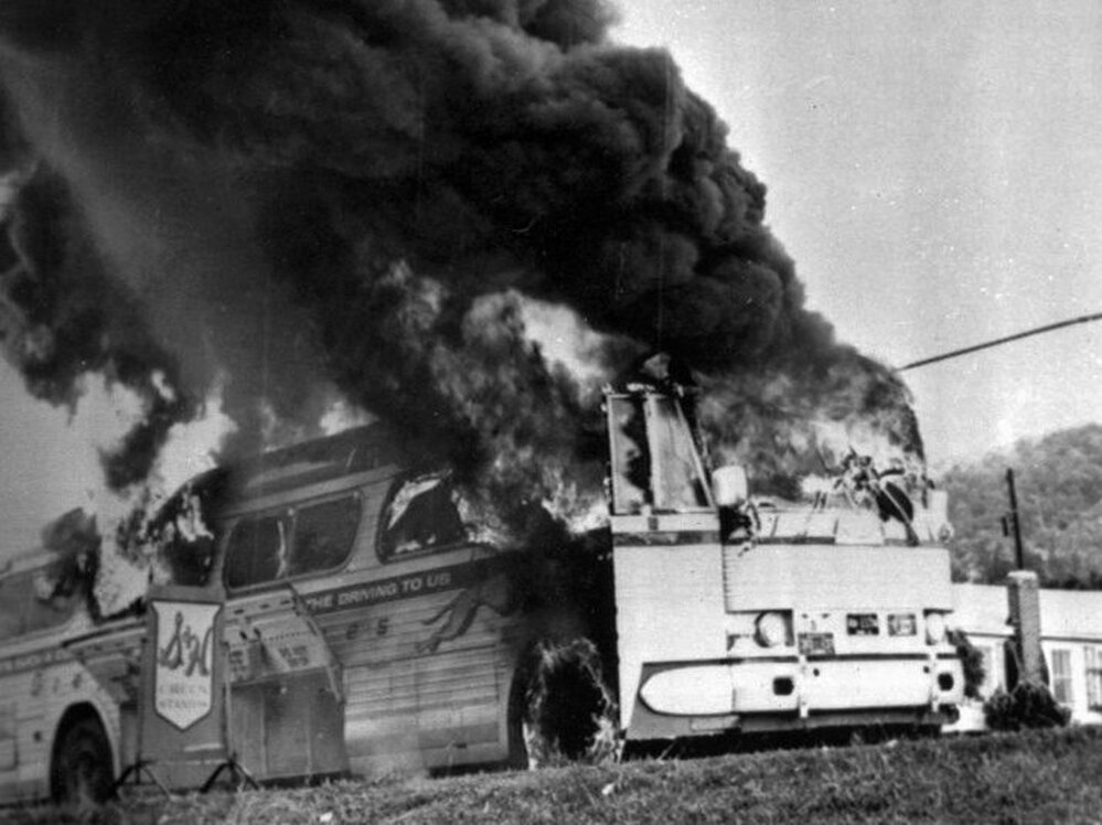 A Freedom Rider bus went up in flames in May 1961 when a firebomb was tossed through a window near Anniston, Ala. Passengers escaped without serious injury.