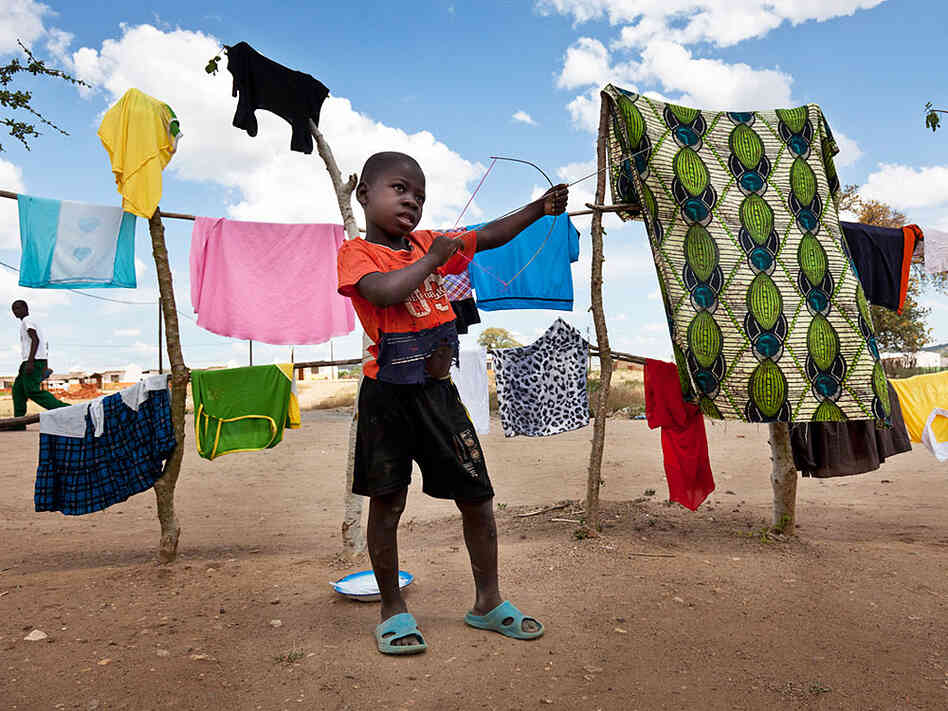A young child plays at the 25 de Setembro settlement; the Vale company has relocated more than 5,000 people, who lived on the land Vale is now developing for coal mining. A young child plays at the 25 de Setembro settlement; the Vale company has relocated more than 5,000 people, who lived on the land Vale is now developing for coal mining.