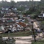 Residents survey the destruction after a tornado hit Pratt City, Ala. just north of downtown Birmingham, Ala. on Wednesday, April 27, 2011.