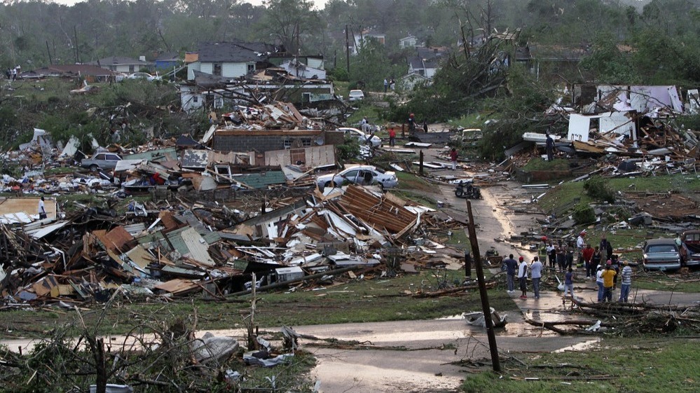 Residents survey wreckage in Pratt City, Ala. just north of downtown Birmingham, on Wednesday, April 27, 2011.