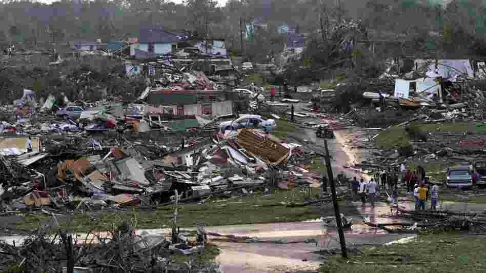 Residents survey wreckage in Pratt City, Ala. just north of downtown Birmingham, on Wednesday, April 27, 2011.
