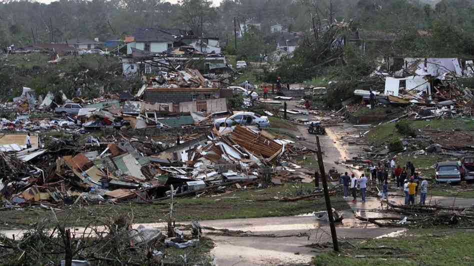 Residents survey wreckage in Pratt City, Ala. just north of downtown Birmingham, on Wednesday, April 27, 2011.