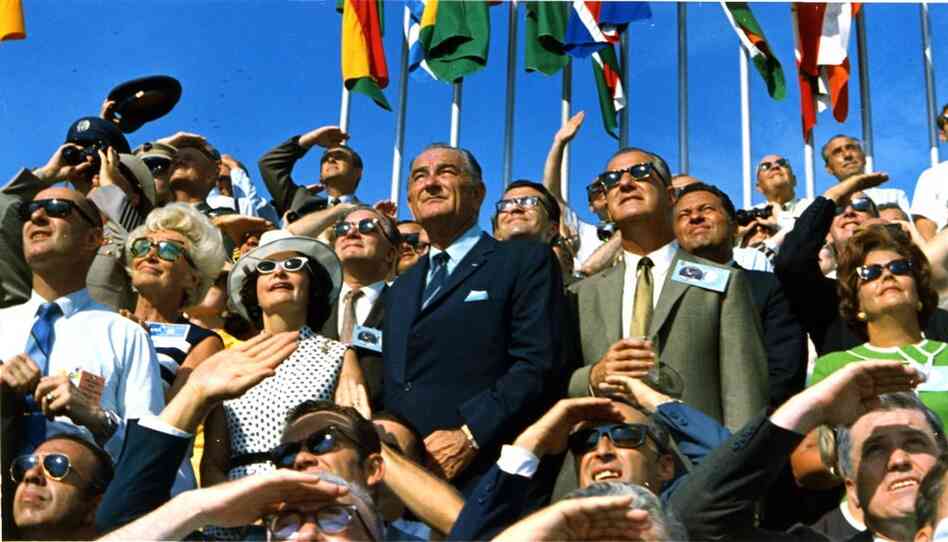 Former President Lyndon B. Johnson (center left) and Vice President Spiro Agnew watch Apollo 11 lift off toward the moon from Kennedy Space Center on July 16, 1969. 