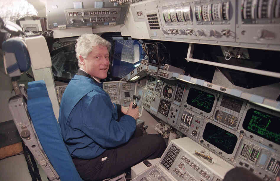 President Bill Clinton sits at the controls of a space shuttle flight simulator at the Johnson Space Center in Houston in February 1994. 