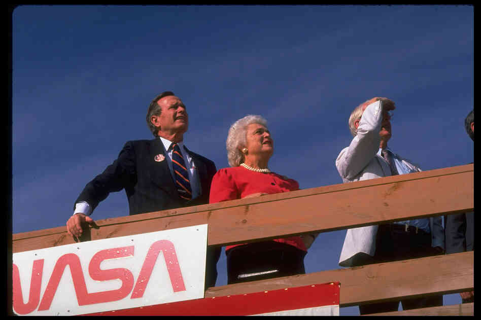 Vice President George H.W. Bush and Barbara Bush await the landing of the space shuttle Discovery at Edwards Air Force Base in California in October 1988. 