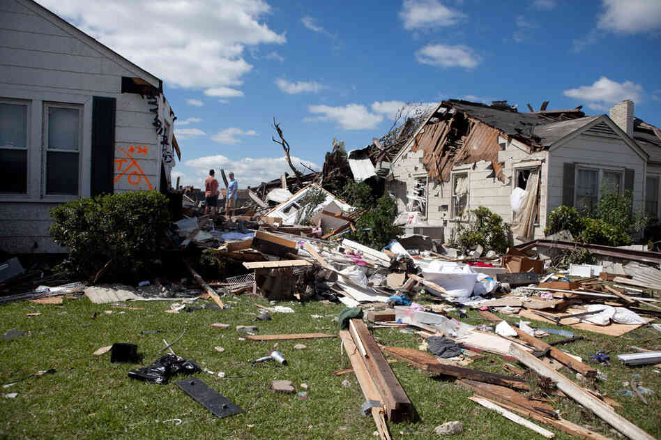 Destroyed homes in the Cedar Crest neighborhood of Tuscaloosa are surrounded by debris. 