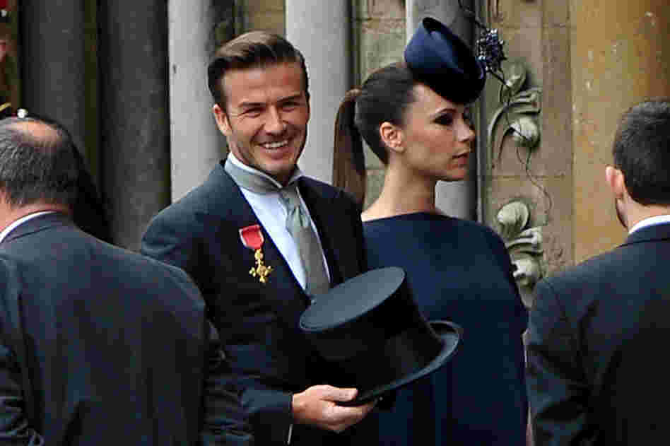 Soccer player David Beckham and his wife, designer Victoria Beckham, arrive at Westminster Abbey. 