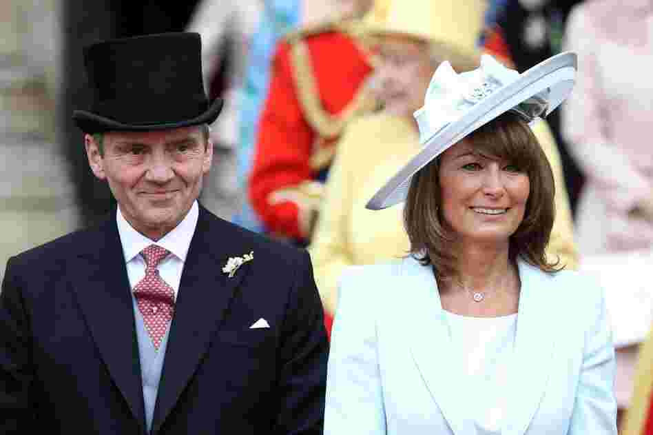 The bride's parents, Michael and Carole Middleton, smile at the crowds after the wedding ceremony. 